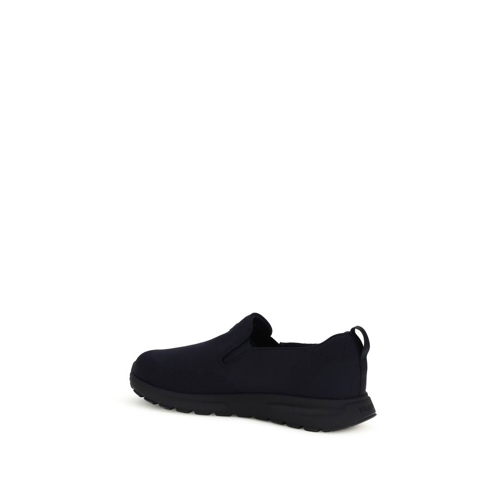 Prada Textured Fabric Slip-On Sneakers in Blue