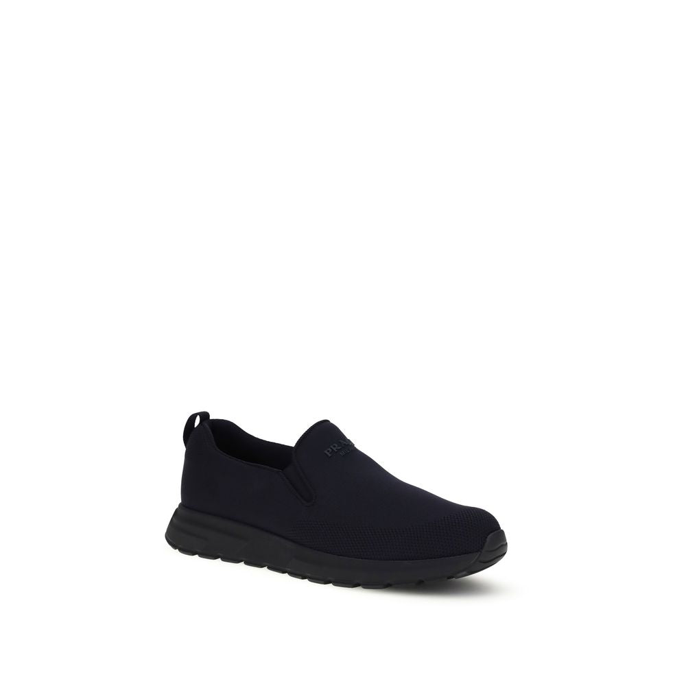 Prada Textured Fabric Slip-On Sneakers in Blue