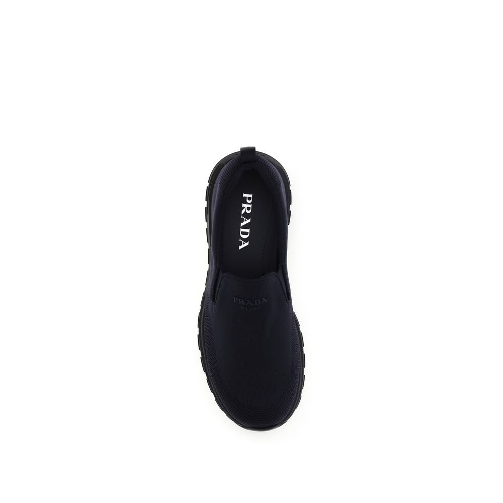 Prada Textured Fabric Slip-On Sneakers in Blue