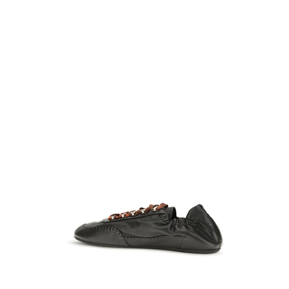 Prada Aged Nappa Leather Sneakers in Black