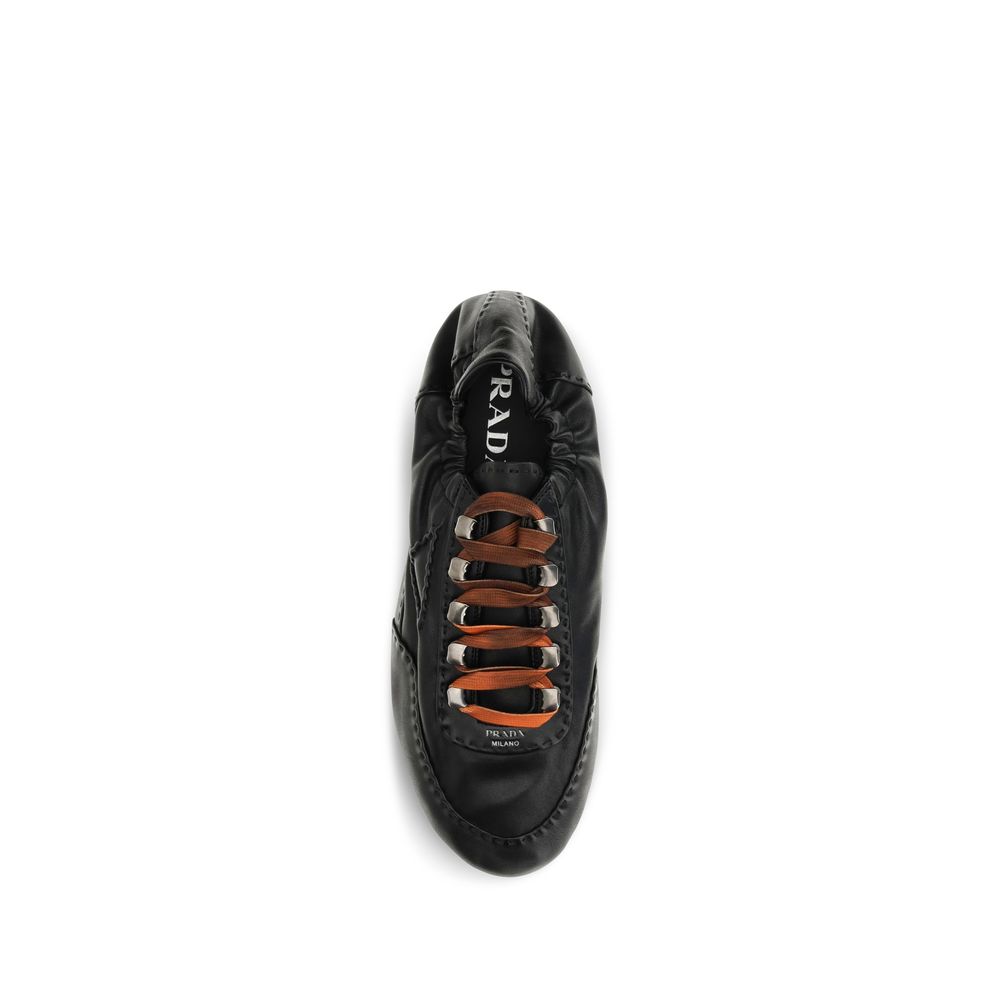 Prada Aged Nappa Leather Sneakers in Black