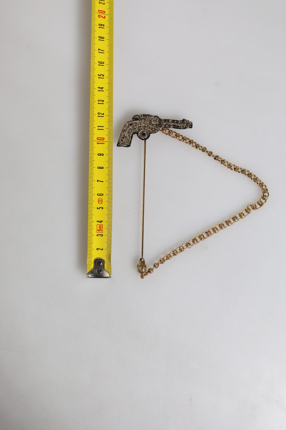 Dolce & Gabbana Brass and Copper Revolver Brooch Lapel Pin in Black and Gold